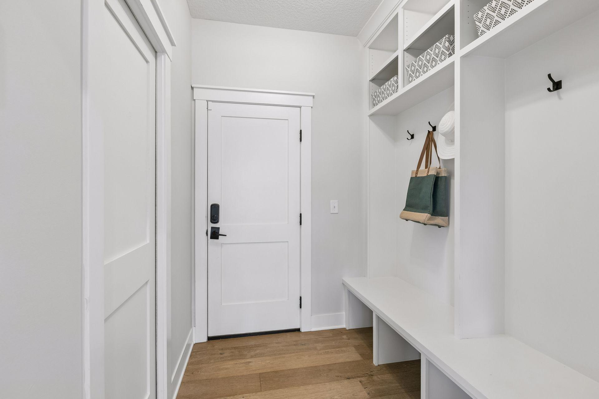Mud room with walk in closet