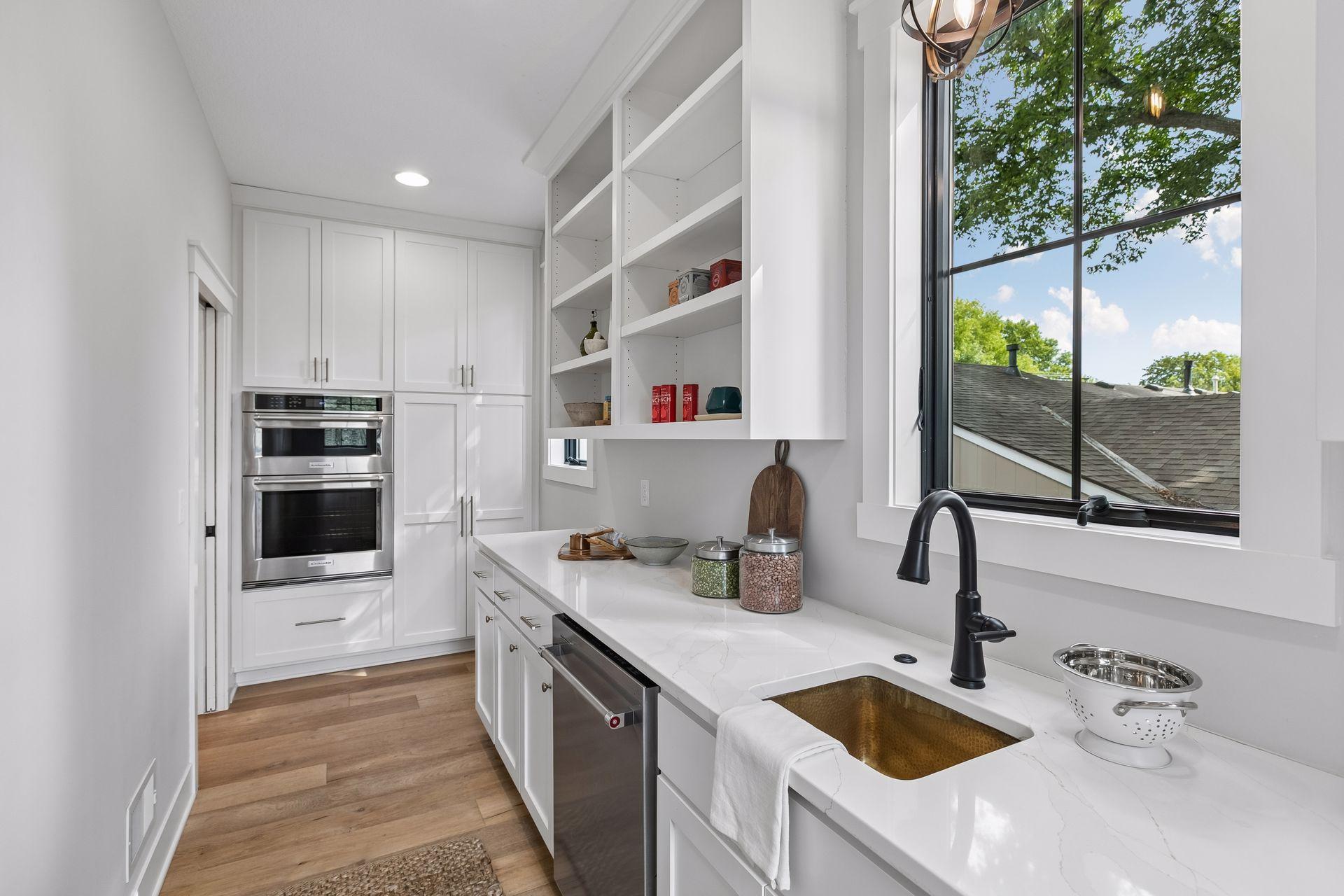 Butlers pantry with double ovens and second dishwasher