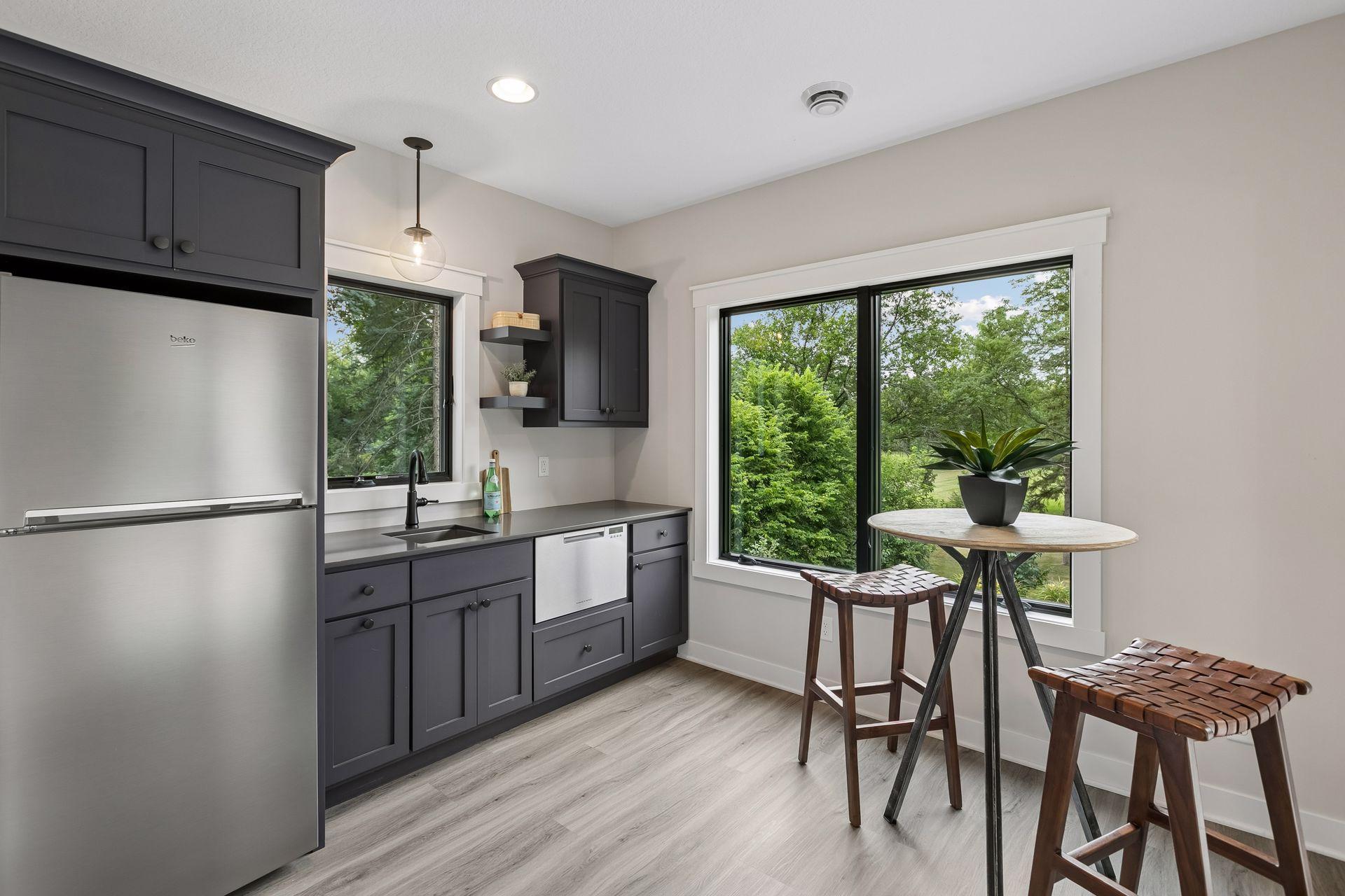 Mini kitchen leads to outdoor patio space