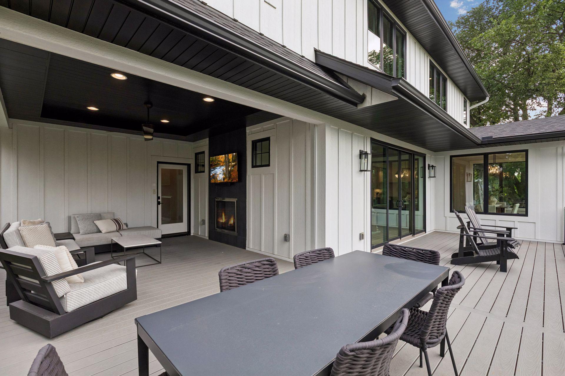 Screen porch open to outdoor dining space