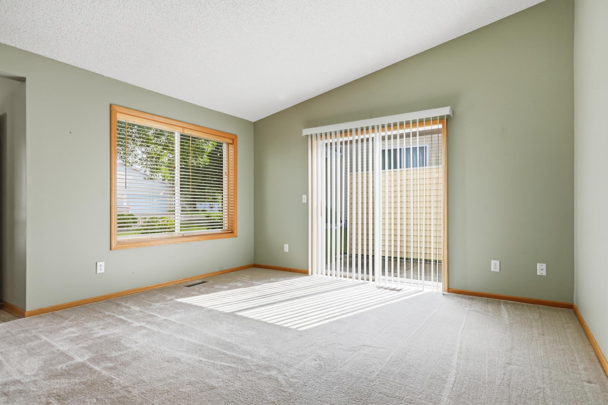 Main level Living room w/ access to the patio