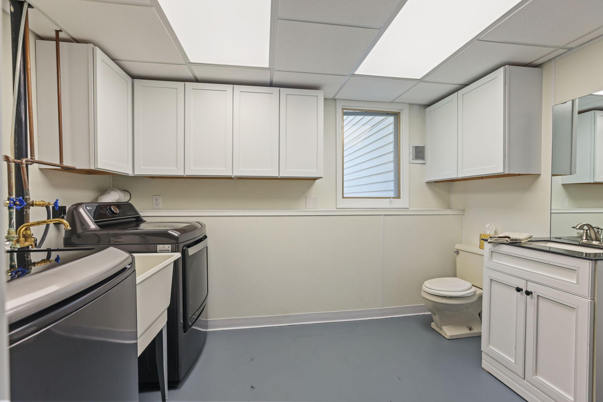 Utility/laundry room with 1/2 bath