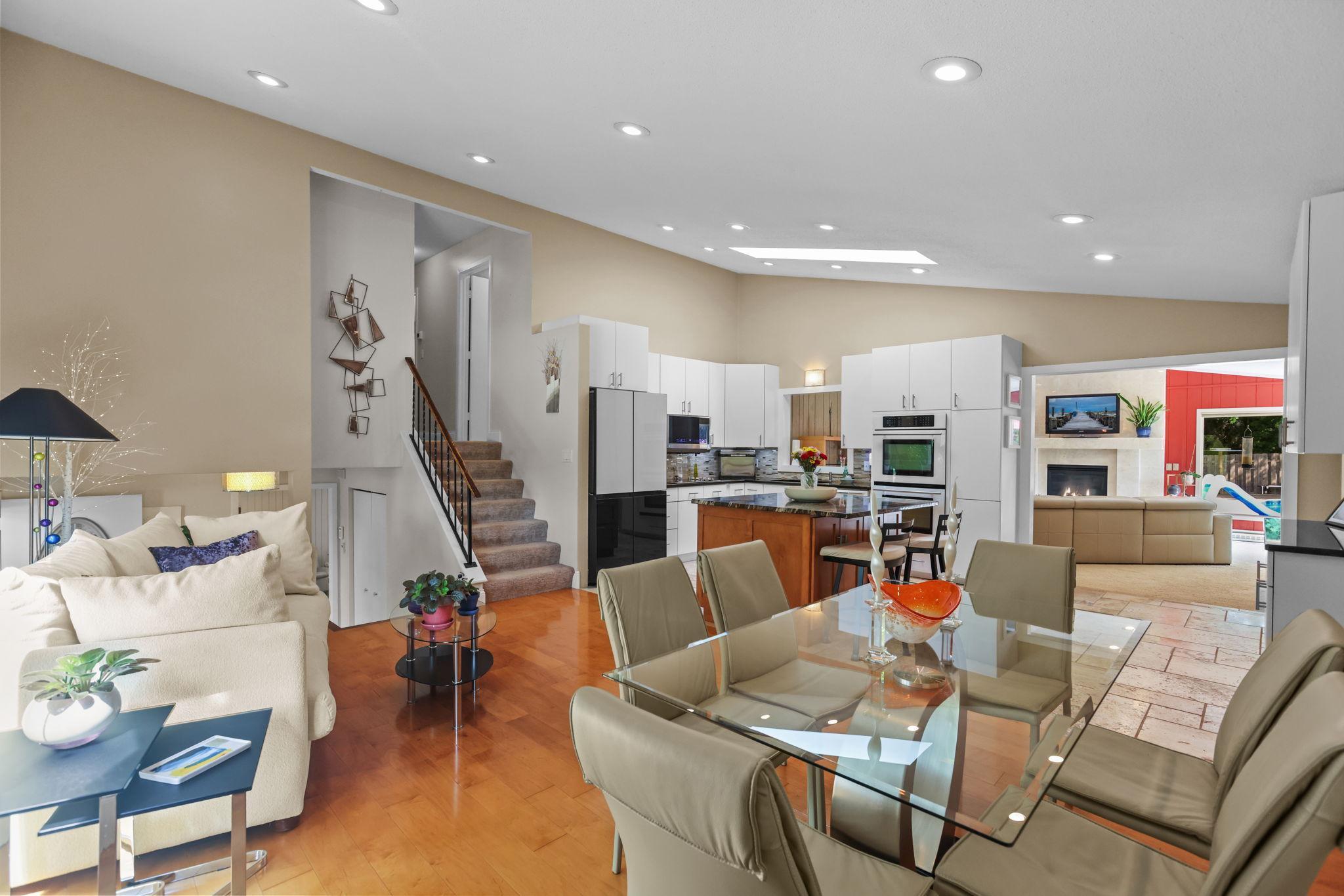 Updated kitchen, updated appliances, vaulted ceiling, separate wall ovens, tile backsplash, granite countertops, hardwood and tile floors, fireplace