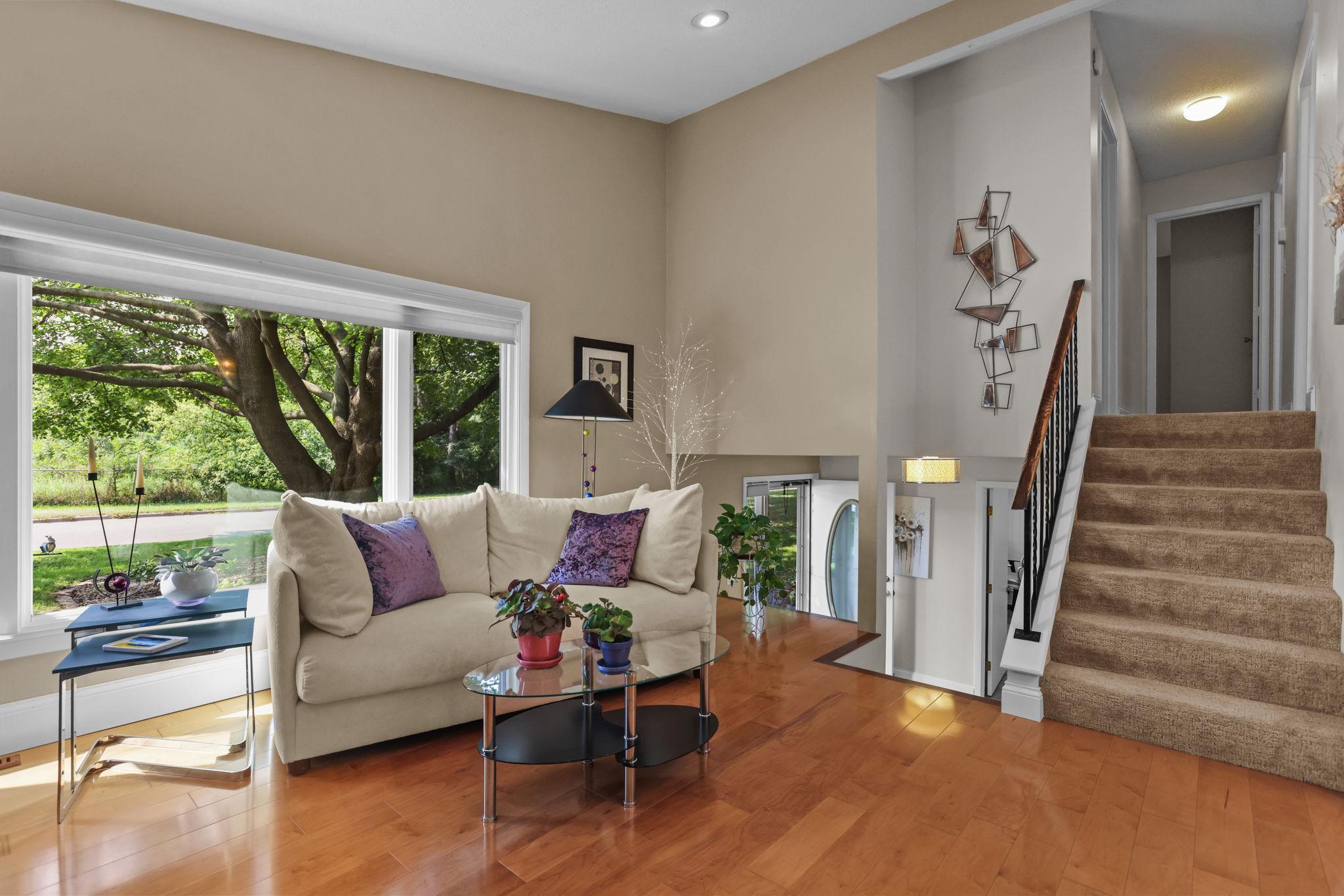South facing large windows provide lots of natural light, hardwood floors, vaulted ceiling
