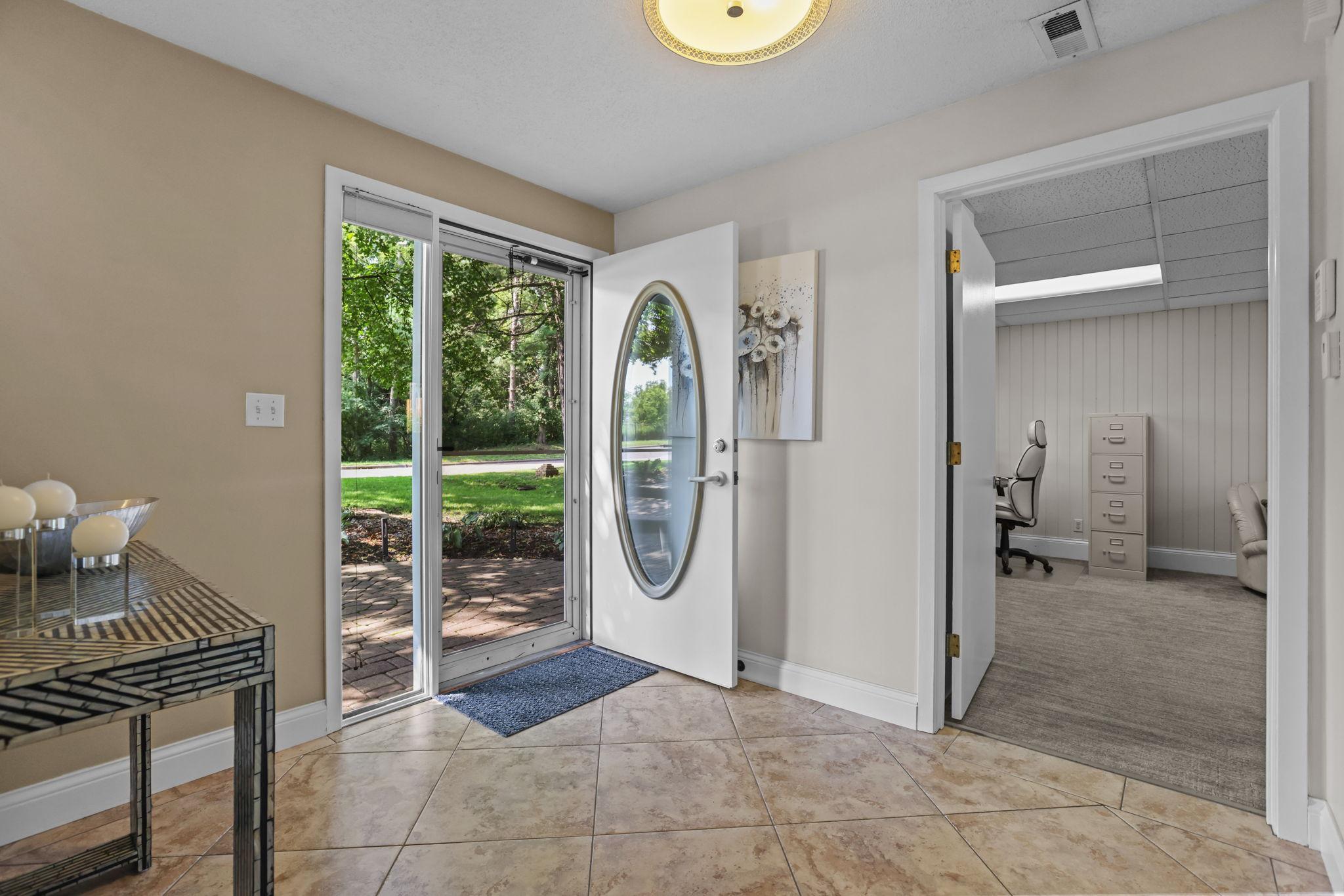 Foyer has a heated tile floor and large closet