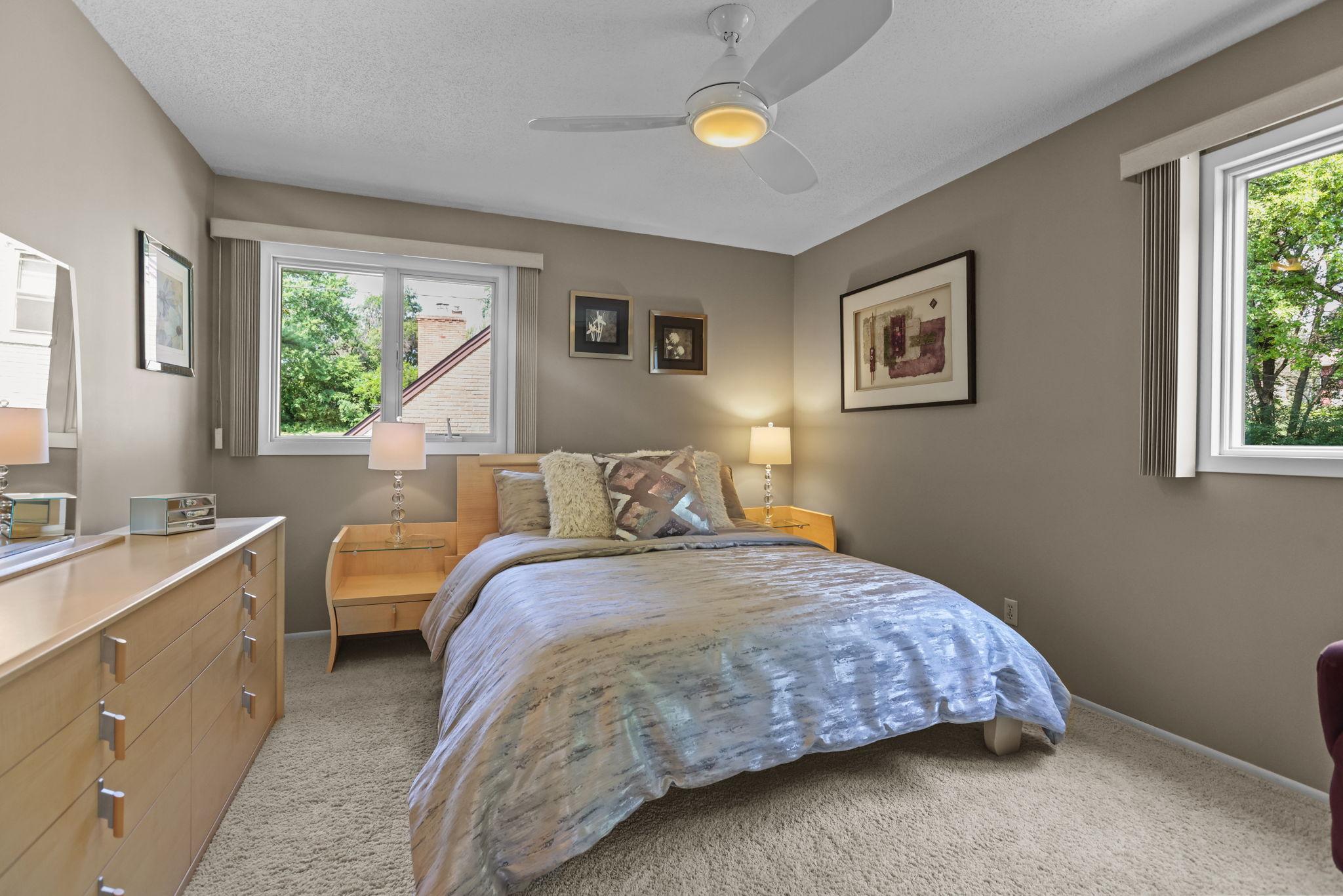 Primary bedroom with large windows
