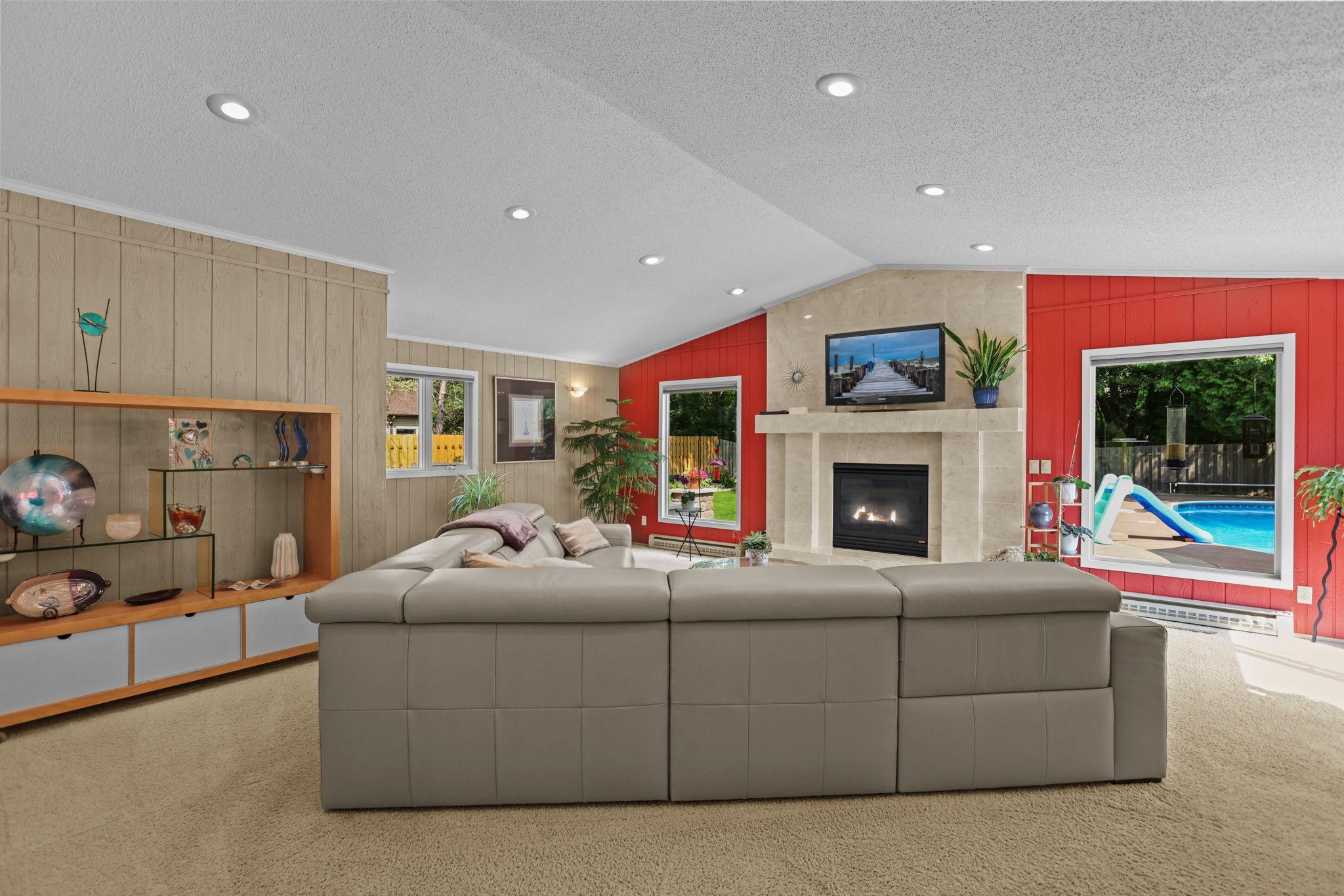 Vaulted ceiling, large windows, view of pool from family room