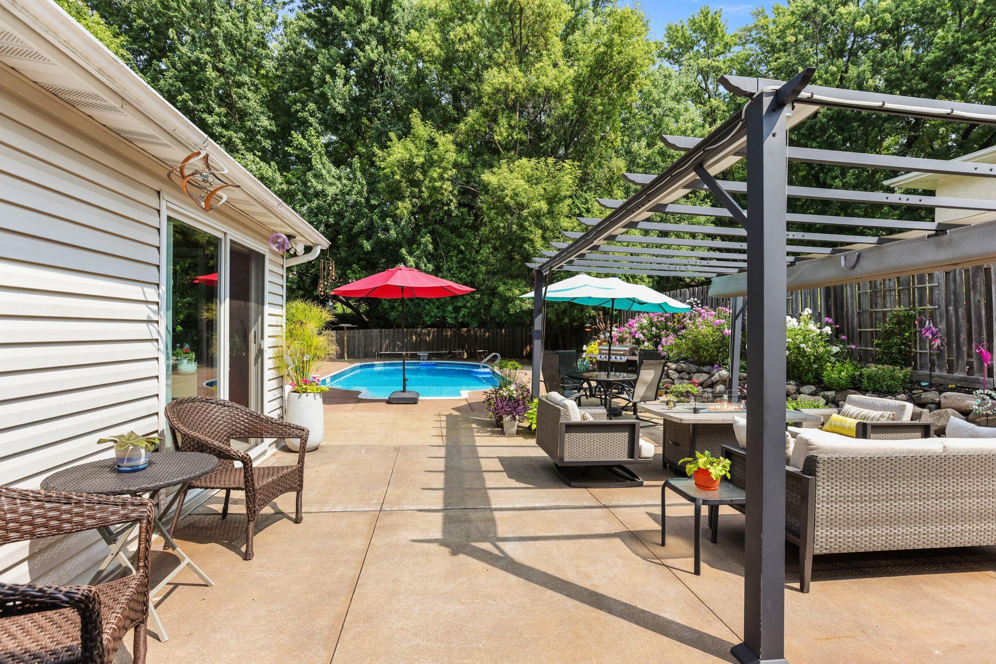 View of patio, pool, patio lounge, and patio dining areas