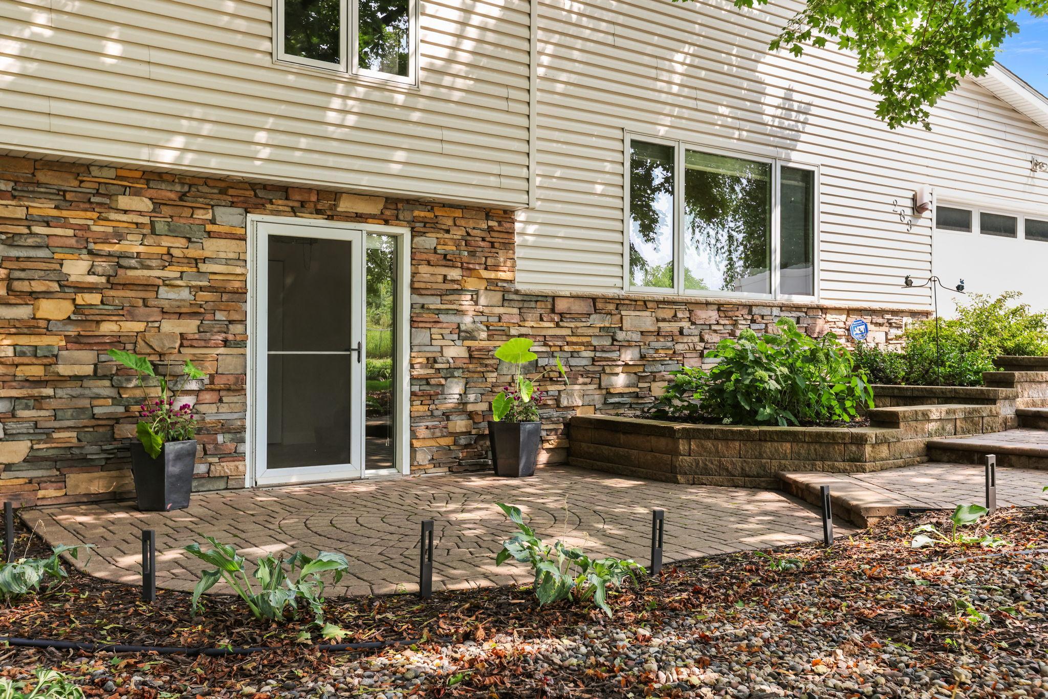 View of front door, paver sidewalk
