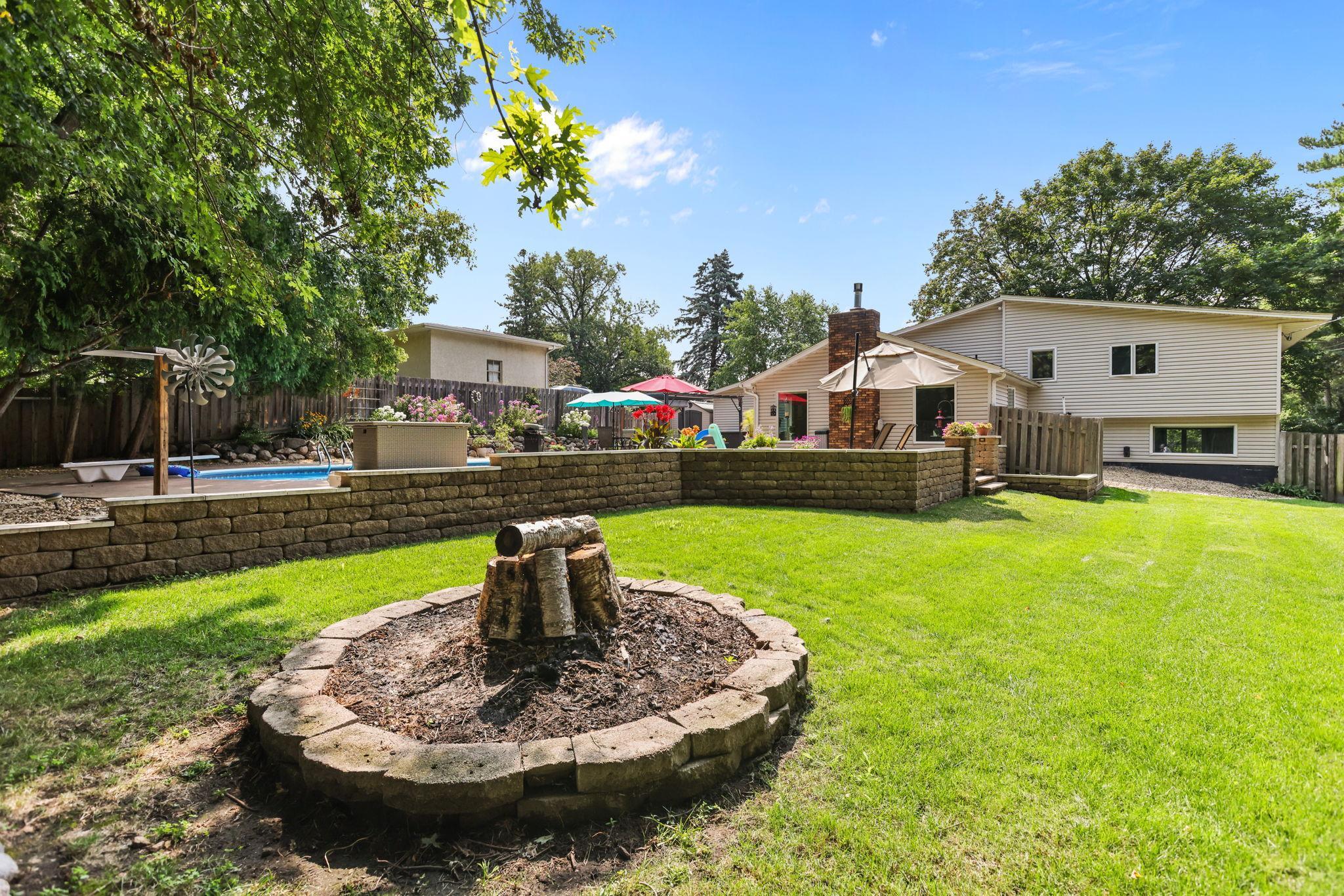 Fire ring, in-ground irrigation, patio, patio wall, pool, patio