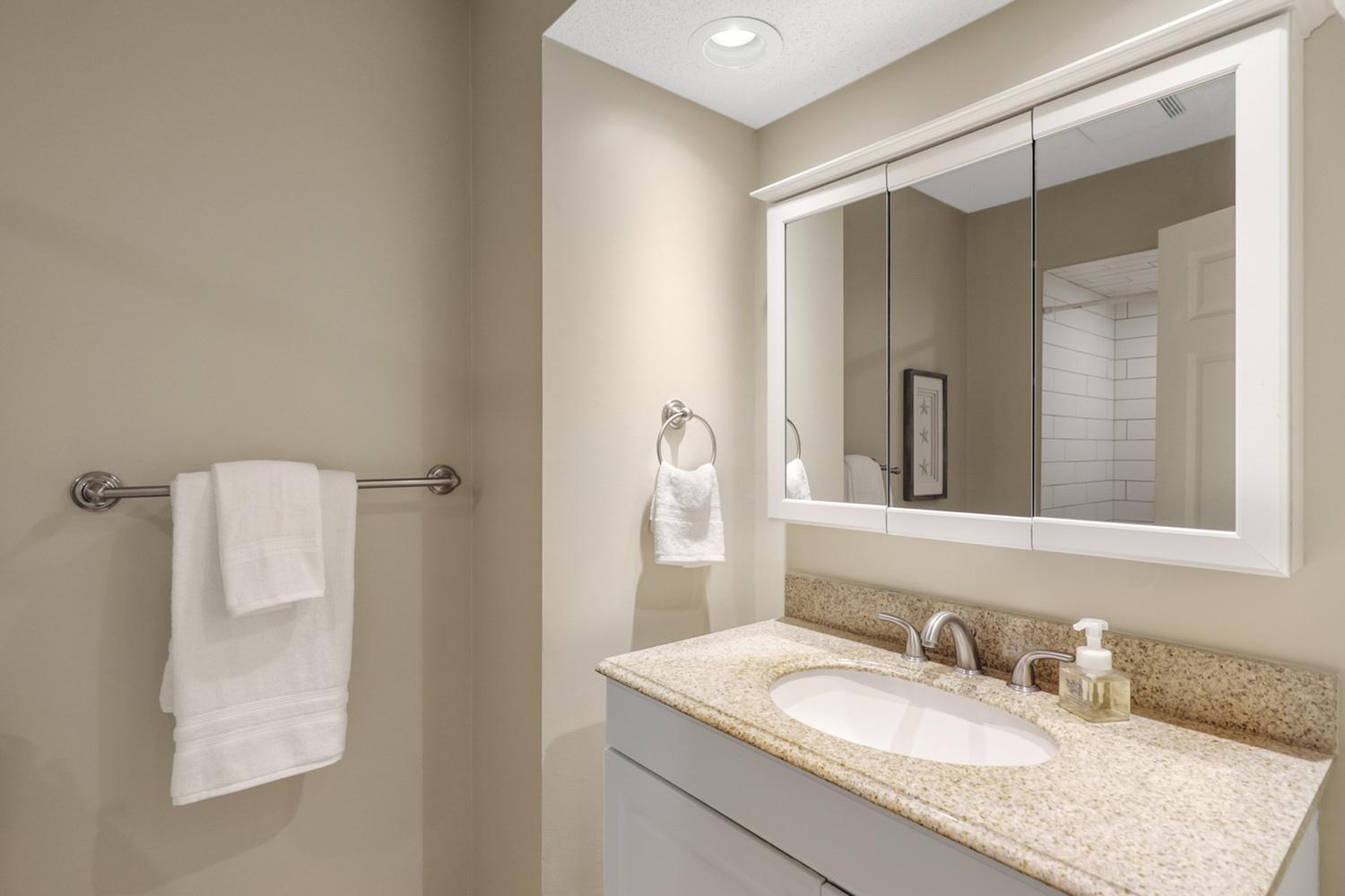 Main level bathroom with a new tiled shower
