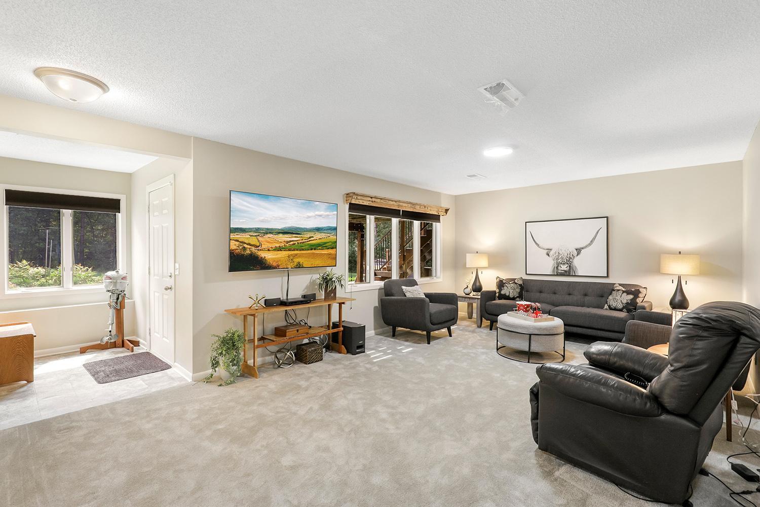 Lower-level family room with a walk out to the backyard