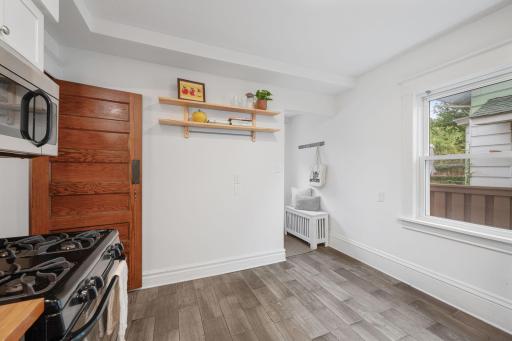 Add an island or a butcher block here, or a small bistro set.