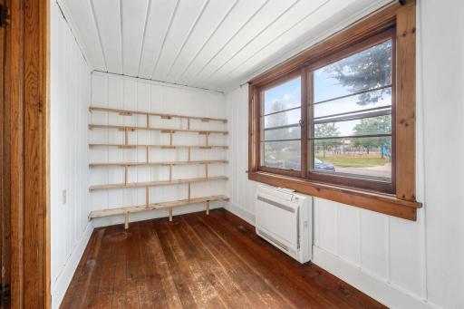 The sun room features a cute built-in bookshelf and a ductless mini split that easily and conveniently cools the main level.