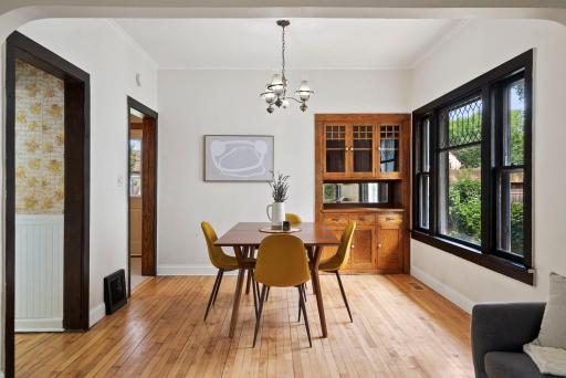 Sunlit dining room w/built in buffet