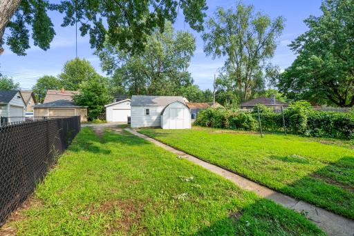 Spacious backyard with storage shed