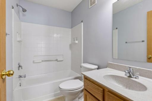 Full upper level bathroom with tub/shower combination.