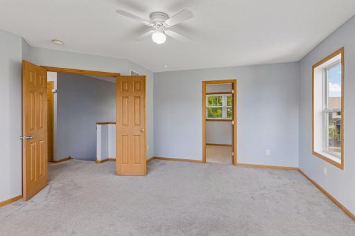 Primary bedroom featuring generous space and french doors