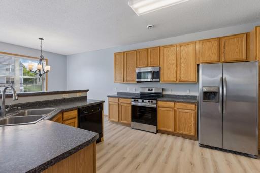 Large kitchen featuring stainless steel appliances