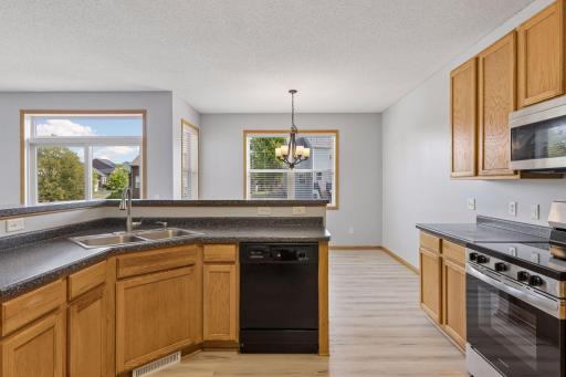 Kitchen opens up to sun-filled dining room