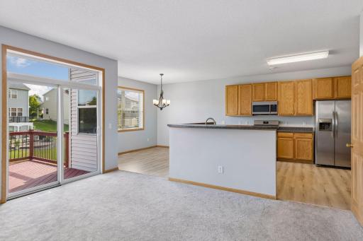 Spacious living room flowing seamlessly into the kitchen.