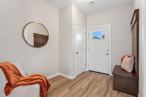 Front entry way welcomes you! Photos from similar home.