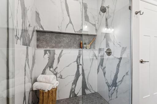 Amazing curb-less shower. Choose from glass or a half-wall. Pick your own tiles. Photos from similar home.