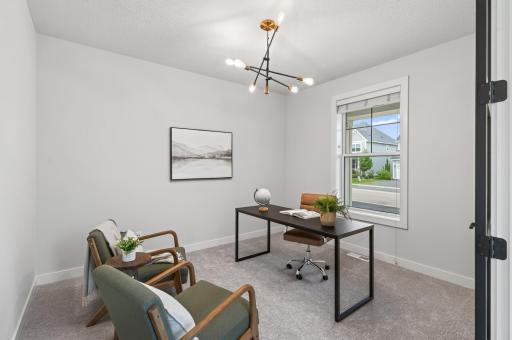 Work from home in style with this main level office, thoughtfully situated away from the kitchen and living room for a quiet, private workspace. Sleek glass and wood double doors add a modern touch.