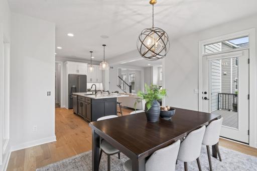 From the dining room, enjoy an open sightline into the kitchen and living room, creating a seamless flow that's perfect for entertaining and everyday family life.