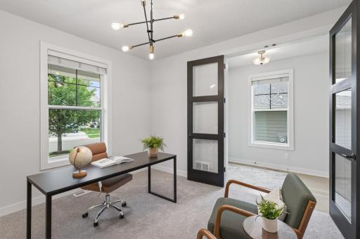 Stunning tall double doors close the office off completely; private, functional, and beautifully designed.