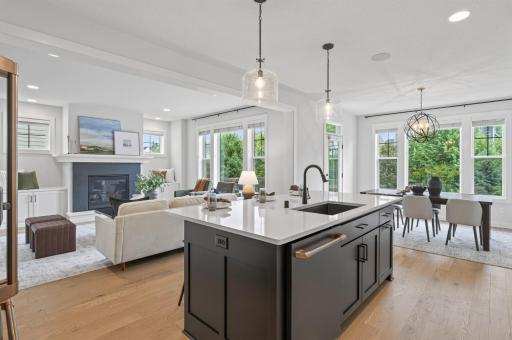 Beautiful hardwood floors throughout the kitchen add a warm, timeless touch that perfectly complements the high-end finishes.
