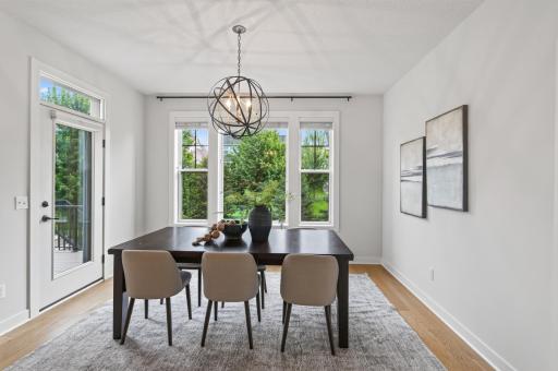 Seamless indoor-outdoor living; the dining room opens onto low-maintenance decking, great for grilling out or supervising family fun on the sports court just below.