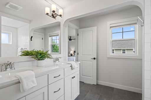 Natural sunlight keeps this bathroom feeling warm, bright, and inviting — the perfect way to start your morning routine.