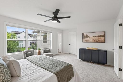This generously sized primary bedroom offers a private walk-in closet and attached 3/4 bathroom; the perfect personal retreat.