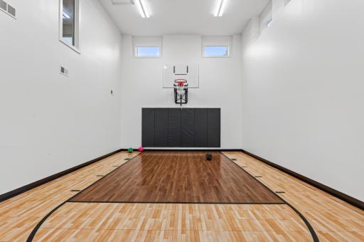 This showstopping sport court will be the envy of the neighborhood, giving the whole family a place to play through the long Minnesota winters. Thoughtfully insulated to keep noise contained from the rest of the home.