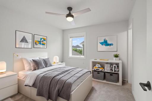 The second bedroom on the upper level features its own full bathroom. Virtually staged.