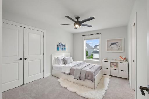 This upper-level fourth bedroom offers a practical Jack-and-Jill bathroom configuration, adding flexibility for family living. Virtually Staged