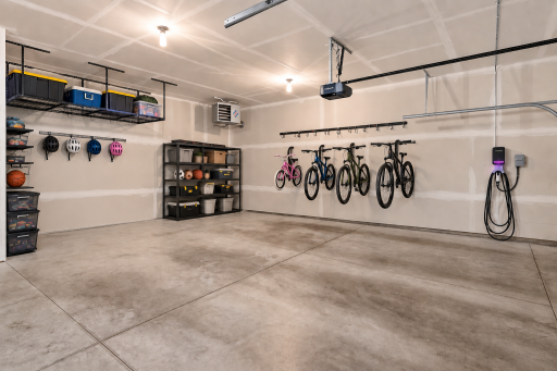 Included the metal storage racks, heater and electric charger in this 3-car garage. Virtually staged with racks for bikes, personal property items and rack for helmets.