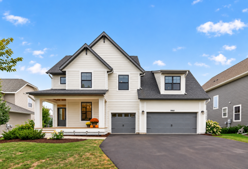Photo for 9960 Arrowwood Trail, Woodbury, MN 55129 - listing #7124491 Bold black windows and durable cement board siding create standout curb appeal. Enjoy Highcroft community amenities including a pool, fitness center, and clubhouse. Virtually staged with seasonal porch décor.