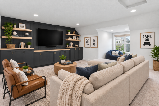 The ultimate hangout spot! Bonus room above the garage featuring custom built-in cabinetry, perfect for movies, gaming, and entertaining. *Virtually staged*