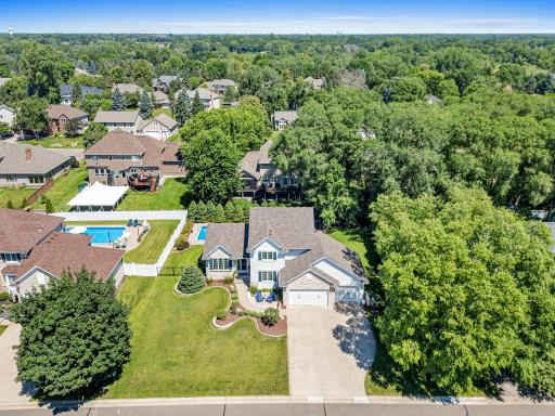 Aerial view showcasing the home’s exceptional setting, spacious yard and desirable Royal Oak Estates West location.