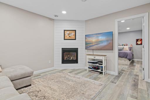 Enjoy movie nights or reading your favorite book by the fireplace in the lower level family room.