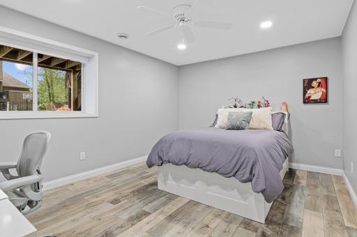 The spacious fourth bedroom is located in the lower level just steps away from the family room.