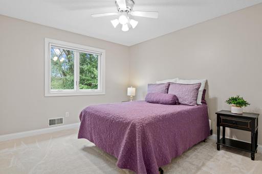One of three upper-level bedrooms feature new carpet and fresh paint for a clean, move-in-ready feel.