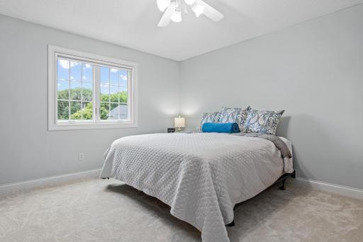 Spacious upper-level owner's suite offers a comfortable and private retreat. New carpet and fresh paint create a bright, refreshed feel.