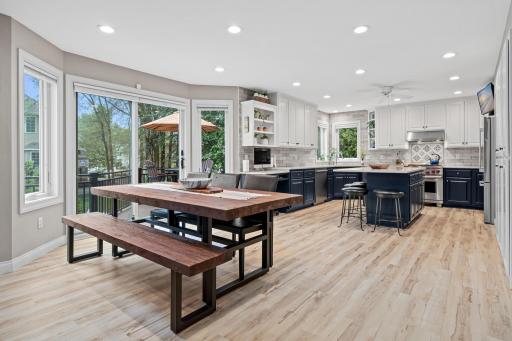 Bright dining area is conveniently located between the kitchen and living spaces. The open floor plan makes everyday meals and entertaining effortless. Easy access to the deck.