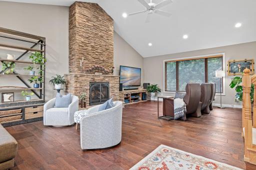 Light-filled living room features impressive vaulted ceilings and an airy, open feel.