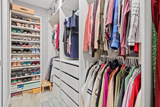 Large walk-in closet with for ultimate organization.