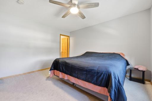 Upper level bedroom, looking into the 3/4 primary bath