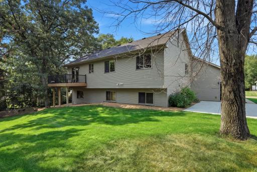 The back of garage/side of home has a large concrete patio perfect for grilling and entertaining.